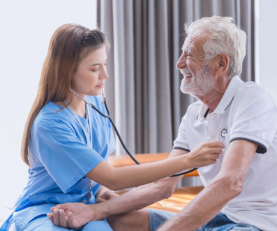 nurse and checking up on elderly veteran